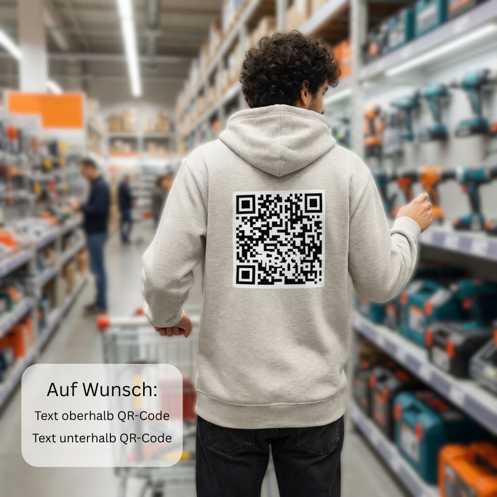 junger Mann im Baumarkt, trägt einen grauen Premium-Hoodie
